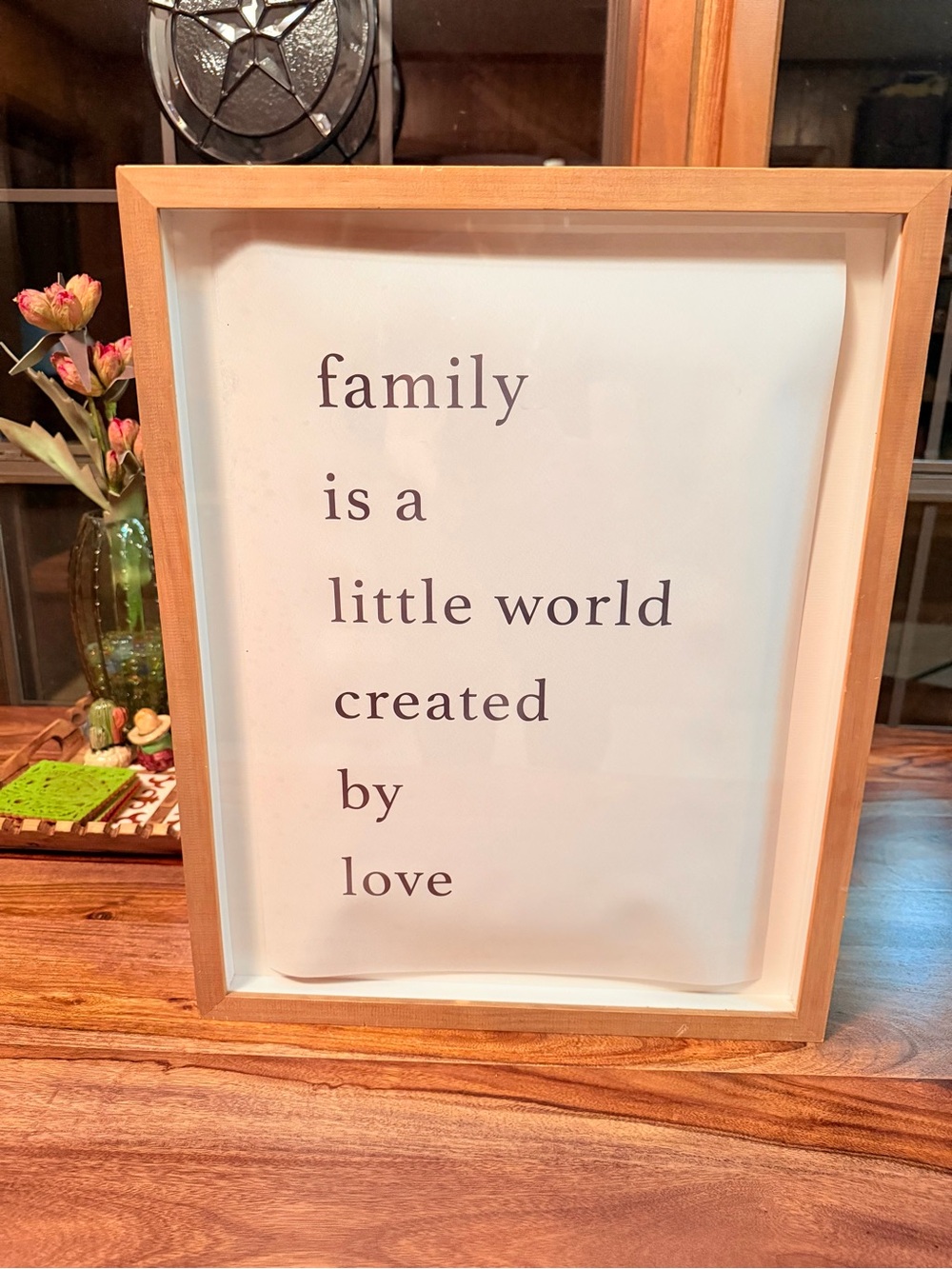 ‘family is a little world created by love’ 16” by 20” by 1” framed Target print.